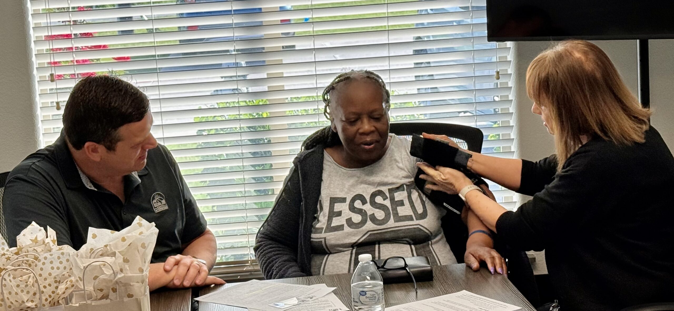 WOW and Texas Health nurses visiting with citizen