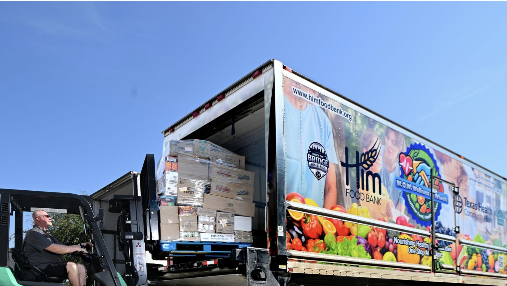 wow truck unloading grocery boxes